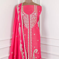 Pink embroidered dress with matching dupatta on a mannequin against a white background