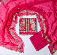 Pink suit with gold embroidery on a white background